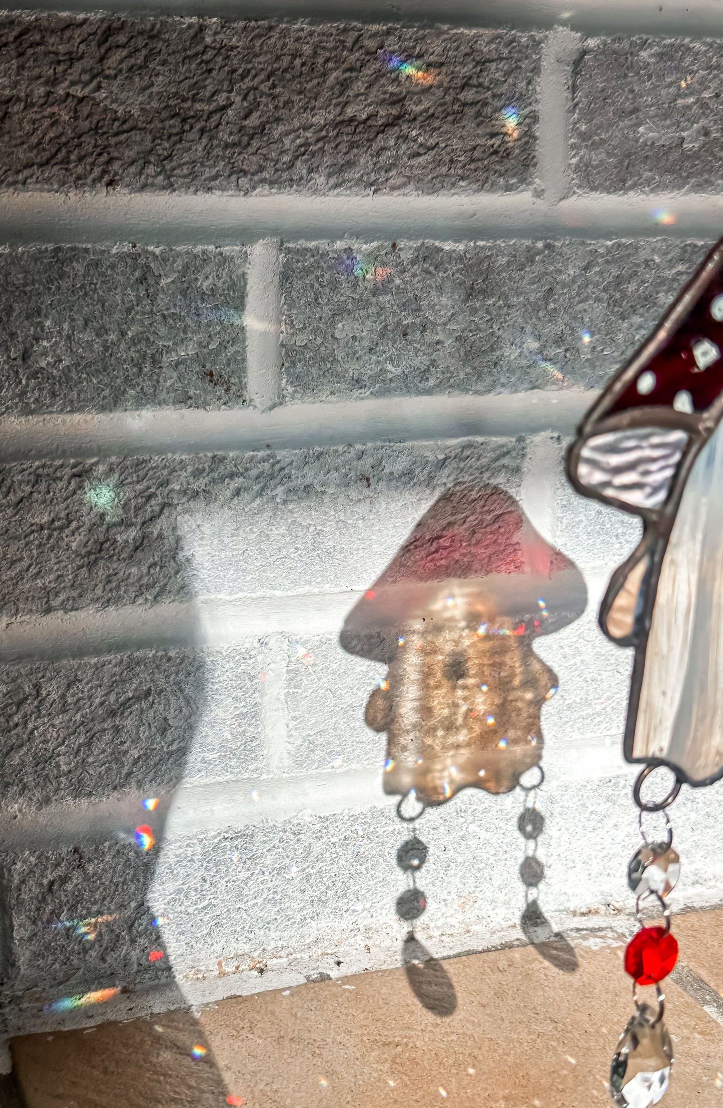 Ghost in red and black streaked mushroom hat