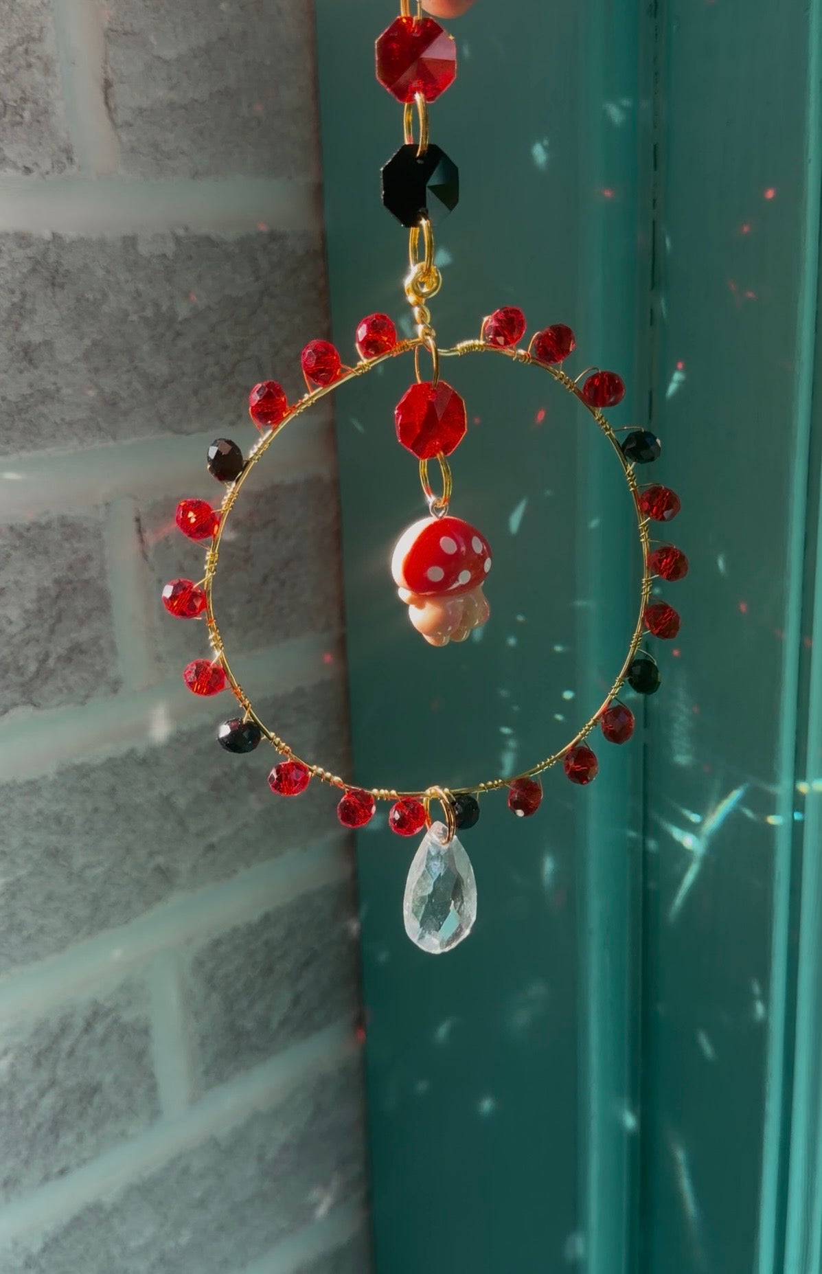 Red Mushroom Butt Suncatcher in a handmade frame