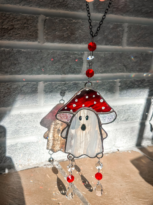 Ghost in red and black streaked mushroom hat