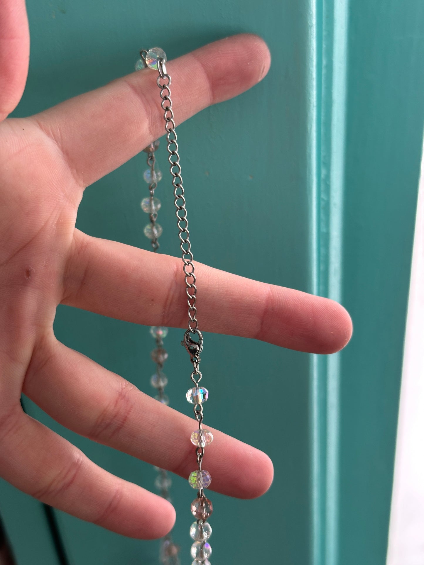 Pink and white iridescent glass seahorse necklace