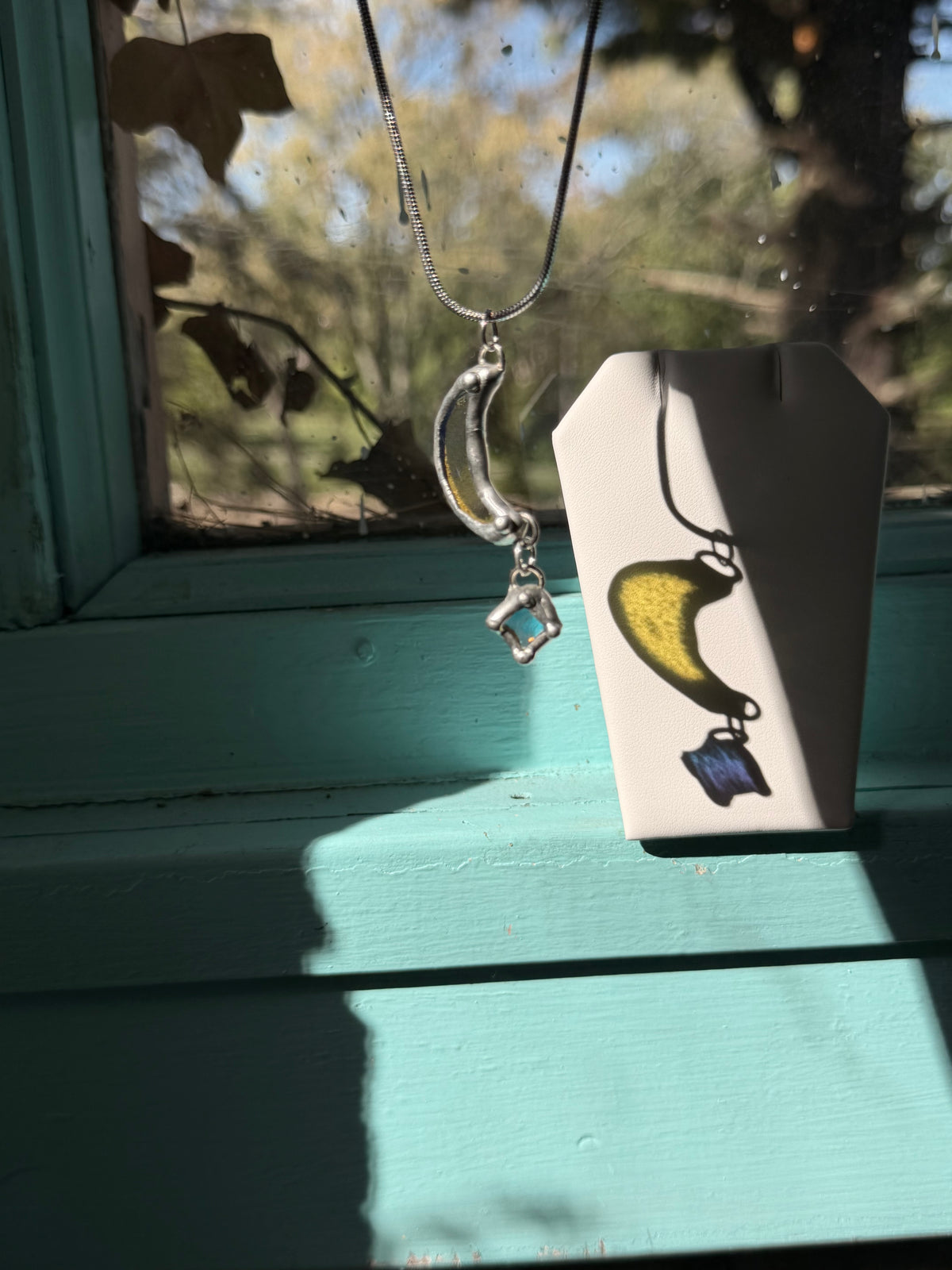 Dichroic Moon with Dangling Star small scratch on moon, reflected in pricing