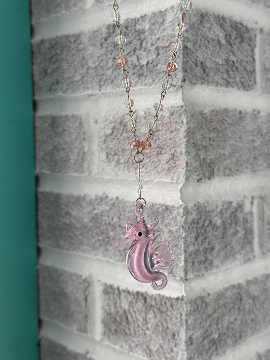 Pink and white iridescent glass seahorse necklace